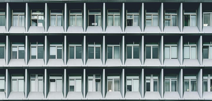 Enterprise AI governance framework for Australian organisations — symmetrical corporate building facade representing structured institutional oversight and regulatory alignment.